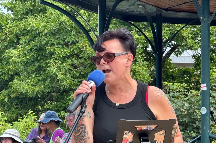 A singer on stage at Okehampton Pride. AQ 5717