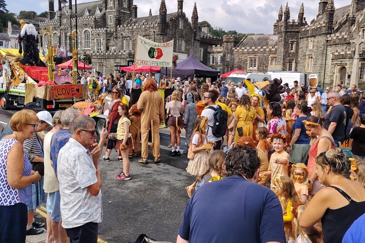 Tavistock Church Schools Federation enter the town centre to cheers as part of Tavistock Lions Carnival parade.