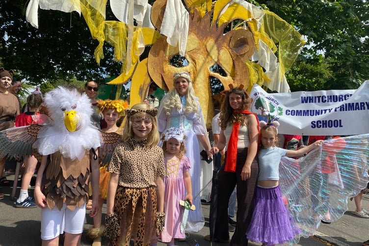 Whitchurch School's giant friendly lion towered above the pupils and staff dressed as the Chronicles of Narnia characters in Tavistock Lions Carnival.