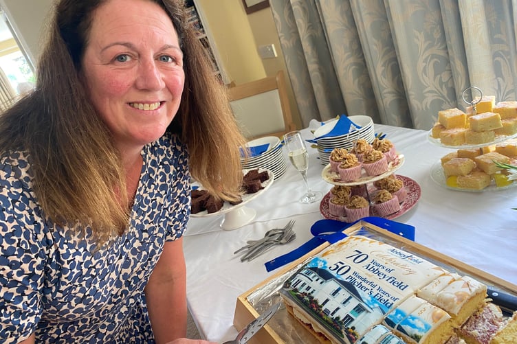Kerry Torr, house manager at Abbeyfield Buckland Moncachorum, with the cake she baked to mark 50 years of the home and 70 years of the international Abbeyfield Society, providing sheltered, independent living.