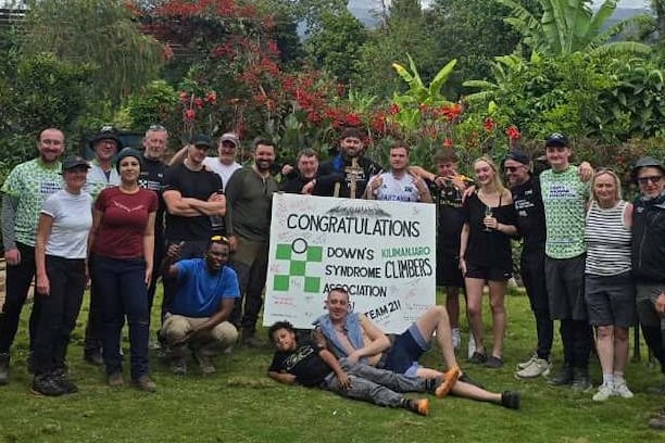 Darren Warkcup and his team celebrate the completion oif their sponsored Mt Kilimanjaro climb in aid of the Down's Syndrome Association charity.