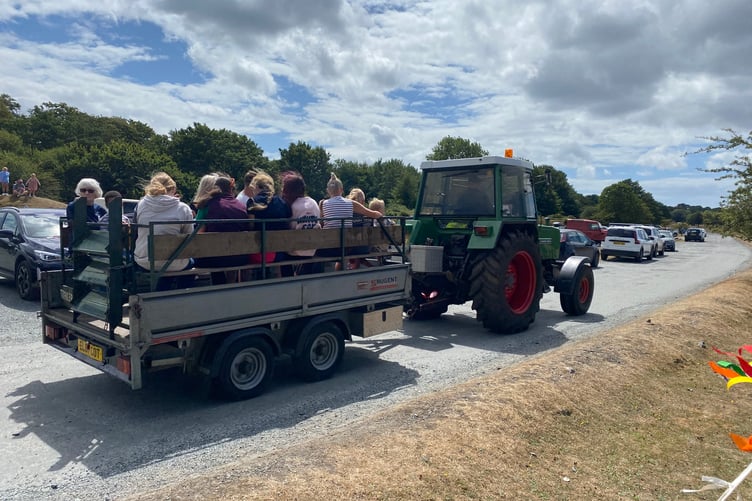 Families enjoy the thrill of a tractor trailer ride at Yelverton Rotary Club free family fun day.