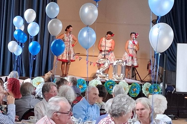 Tavistock Memory Cafe carers, family, volunteers and guests celebrated its twentieth year with a party in Tavistock Town Hall.