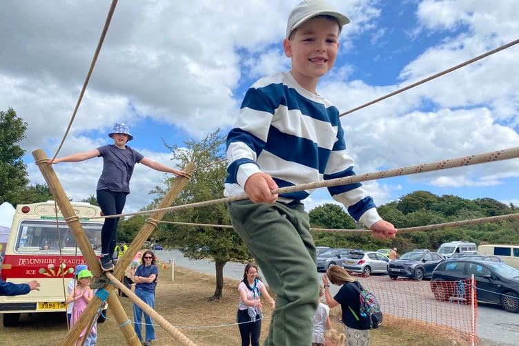 Keeping your balance on the tricky rope bridge at Yelverton Rotary Club Family Fun Day.