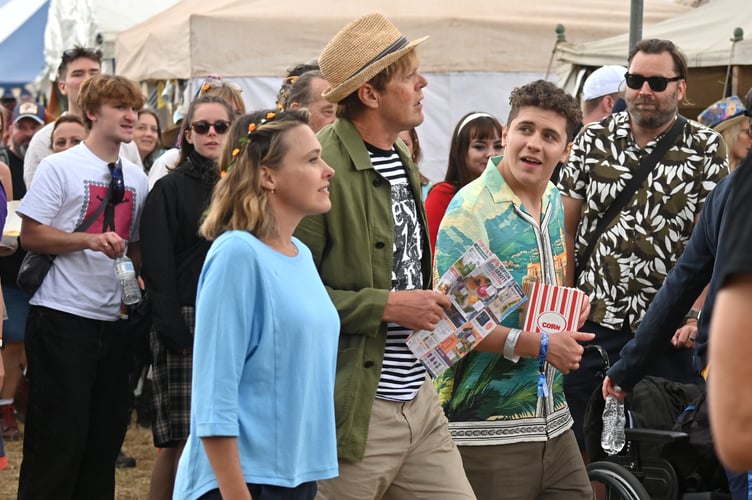 Beautiful Days music festival at Escot Park. Actors. Sally Bretton, Kris Marshall and Dylan Llewellyn filming an episode of Beyond Paradise at the event