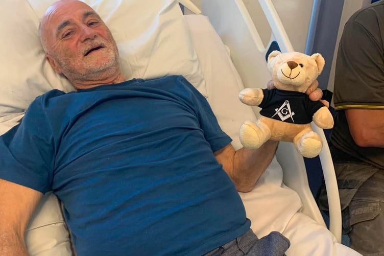 Collytown farmer Arthur Blamey at Derriford Hospital after his severe crush injuries. He is holding one of the hundreds of toy bears he distributes, as a Freemason, to children in hospital.