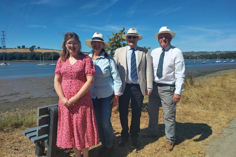A memorial bench at Weir Quay in tribute to Doris Chapman. Left to right: Doris's daughter Rebecca Townsend, Jessica Townsend, and Rebecca's partner Paul Townsend? and Cllr Richard Leithall (Bere Ferrers Parish Council chair).