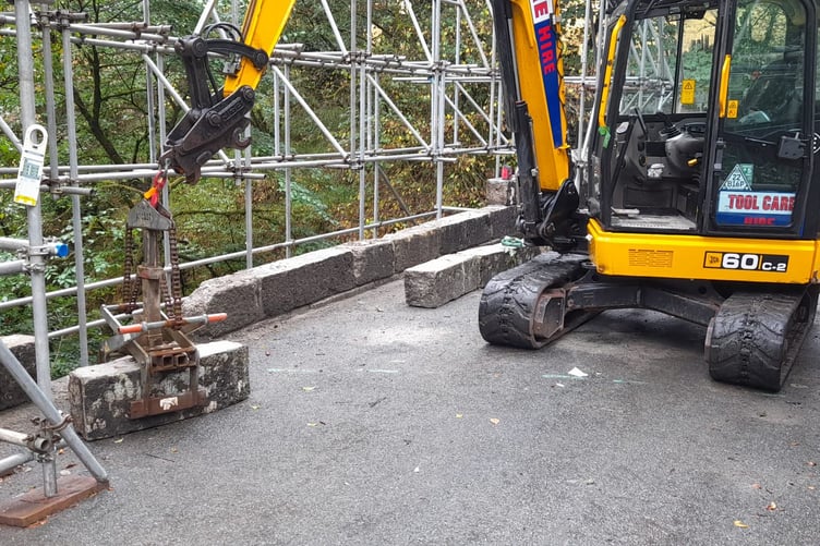 Work in progress replacing stone blocks in the parapet of the Lydford bridge