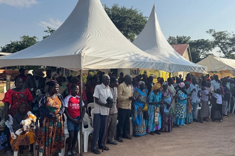 Crowds of villagers and rural residents queue for pain relief at the Smilestar dental charity.