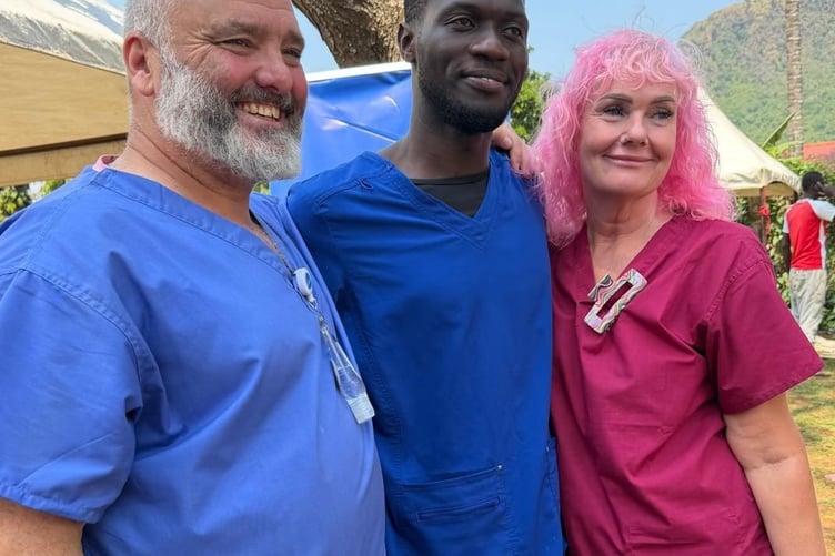 Claire and Lee Spencer, of Horrabridge, helping a dentist at a charity dental clinic in Uganda.
