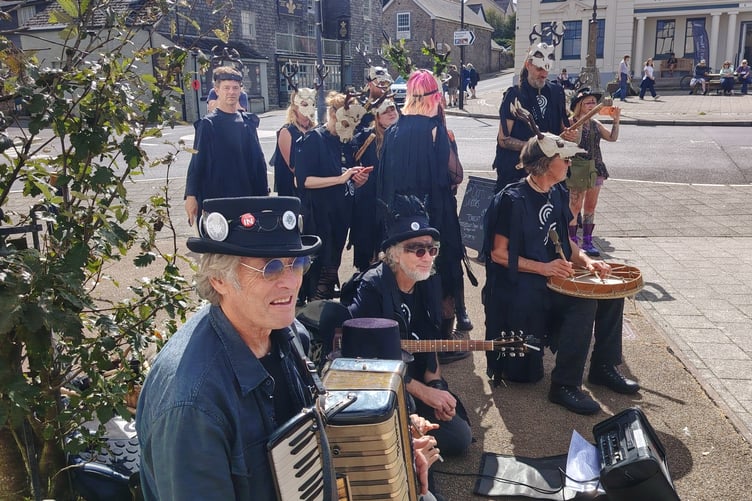 Masked dancers and musicians join the Princetown celebrations marking the Border Morris group's quarter century.