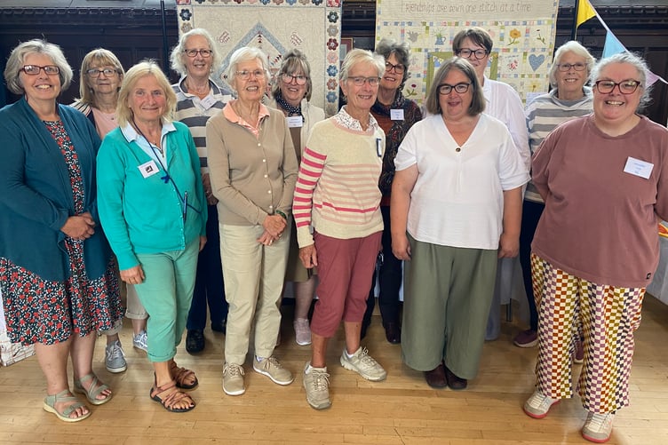 Needle artists from community group the Goosey Quilters displaying their creations in Tavistock Town Hall.