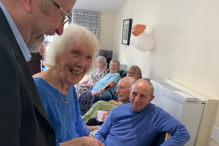 Newly-wed Roy and Rotha Cole cut a post-wedding party cake at Abbeyfield residential home in Tavistock with guests.