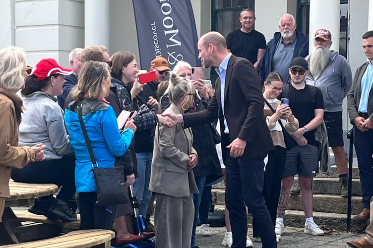 The prince chatting to people who had come to meet him outside the revamped visitor centre in Princetown.
